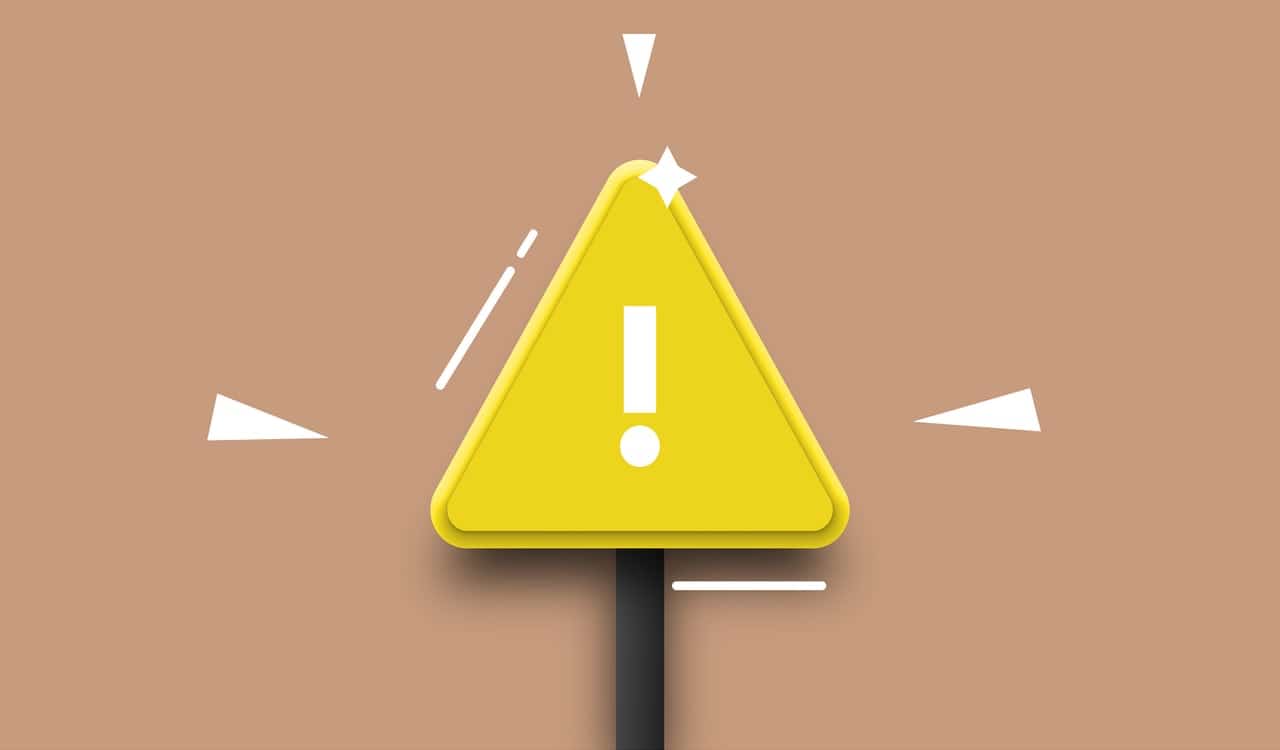 A picture of an alert sign as this article is about mitigating threats through the top risk management software solutions.
